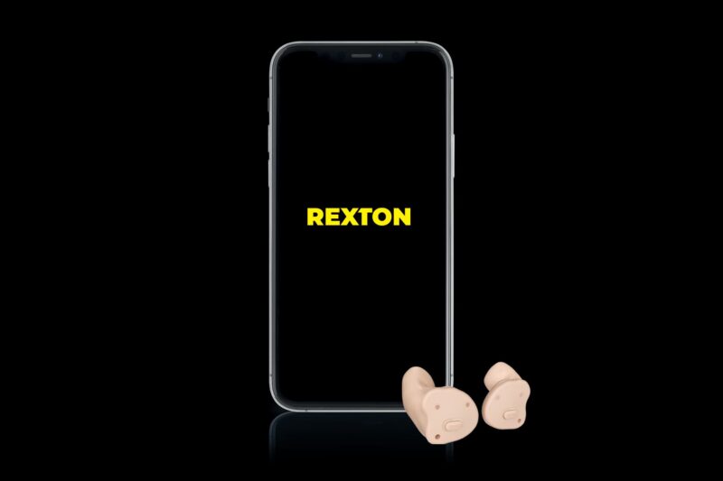 a cell phone that features the name "rexton" in yellow with a pair of hearing aids